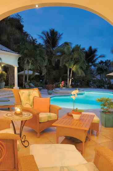 A free-flow design blurs the line between the indoor and outdoor living spaces that open onto a lagoonlike pool.